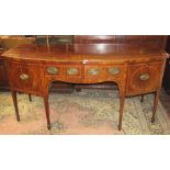 A good quality George III mahogany bow fronted sideboard with callarette, cupboard and two frieze