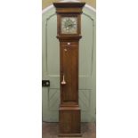 An oak longcase clock, the square cut hood with column supports enclosing a 10 inch square brass