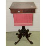 A 19th century mahogany sewing/work table, the shallow boxed hinged lid enclosing segmented lidded