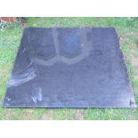 A polished black granite slab or kitchen work surface with rounded corners (4ft square)