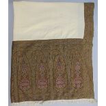 19th century shawl with woven borders around a central cream field, in olive, terracotta and brown