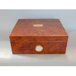 Interesting burr wood veneered humidor with hygrometer inserted into the front, 26cm wide