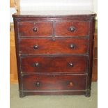 A Victorian mahogany veneered bedroom chest of two short over three long graduated drawers flanked