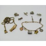 Antique 9ct bracelet hung with a 9ct heart charm and various silver charms to include a Jack-in-