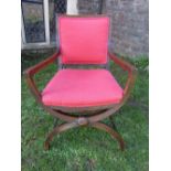 An Edwardian mahogany X framed side chair with reeded framework, upholstered seat and back