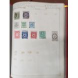 A collection of stamps from Korea, Japan and Tibet in a red album