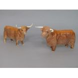 A Beswick highland bull and highland cow