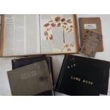 A box containing a mixed collection of ephemera including photograph album, scrap book, loose