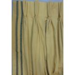 One good pair of good quality contemporary curtains in gold fabric with contrasting braid trim,