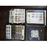 A box containing 12 albums of world stamps
