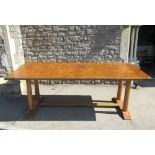 A good quality contemporary refectory dining table with well matched veneered panelled top raised on