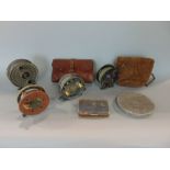 A collection of fishing reels and accessories to include a Hardy the Silex no 2 reel and Hardy Fly