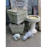 A pair of Cotswold Studio composition stone garden planters of square tapered form with decorative