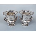 Good quality pair of silver plated campana urn wine coolers, the cast berry rims over faceted