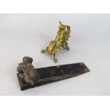 Novelty cast metal door wedge with cast bronze playful dog mount, together with a further ormolu