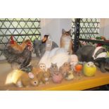 A collection of contemporary novelty composite garden ornaments to include a fox, badger, swan,