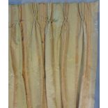 Two pairs of lined and blanket lined curtains with triple pleat heading in subtle shades of gold,
