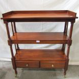 A reproduction hardwood three tier bookcase/whatnot with open shelves over two drawers, turned