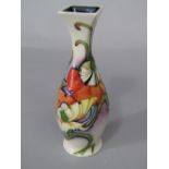 A Moorcroft collectors club vase with abstract style floral decoration on a cream ground, dated