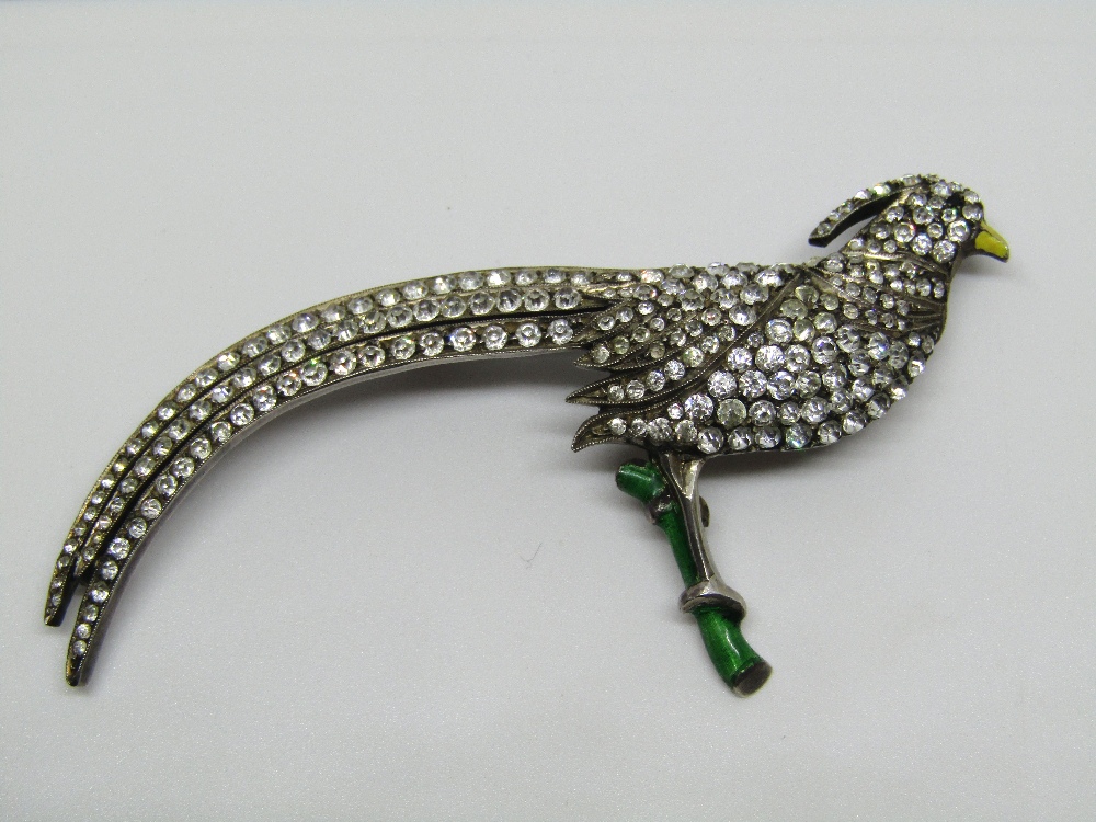 Silver brooch modelled as an exotic pheasant, set with paste and with enamelled decoration