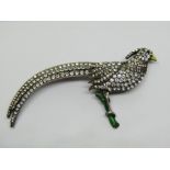 Silver brooch modelled as an exotic pheasant, set with paste and with enamelled decoration