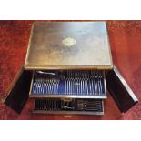 19th century canteen of beaded flatware, the oak box with twin doors enclosing four graduated