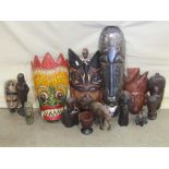 Tribal Interest - A box containing a quantity of carved African and ethnic figures, busts, face