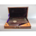 A good quality mahogany cased Auto Harp by Georg Tiefenbrunner, the case 54cm wide