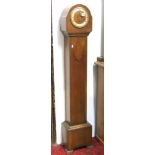 An Art Deco style oak cased grandmother clock with three train movement and chapter ring with