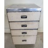 A vintage steel industrial cabinet fitted with four long graduated drawers, with partially painted