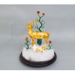 An interesting Venetian glass diorama comprising a stag and dog in a winter landscape under a