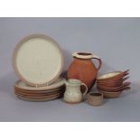 A collection of Winchcombe studio pottery wares with speckled glaze comprising six dinner plates and