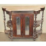 A Victorian walnut side cabinet enclosed by a pair of slender arched mirror panelled doors,