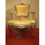 Louis XVI style fauteuil with upholstered seat and padded arms on cabriole supports, with carved and