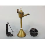 A Dutch brass drip spout lamp, together with a double cruisie lamp, ships gimble oil lamp, wrought