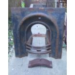 A 19th century cast iron fire insert, the arched centre with foliate bands and bow fronted basket,