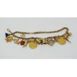 Good antique 9ct fancy link charm bracelet hung with two sovereigns dated 1898 and 1891, an