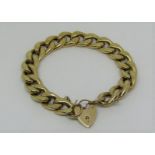 Substantial 9ct curb link bracelet with heart padlock clasp, 29.2g