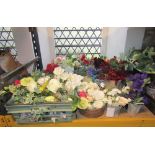 A large collection/display of artificial flowers with labels accredited by the British Florist