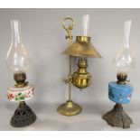 A late 19th century brass adjustable oil lamp, with brass shade and stand; together with a further