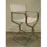 A vintage directors type chair with folding chromium frame, together with a similar low stool with