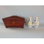 Early 19th century mahogany and boxwood inlaid sarcophagus tea caddy, the hinged lid enclosing a