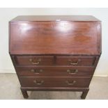 A Russell of Broadway mahogany writing bureau, the fall flap enclosing a simply fitted interior over