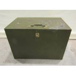 An iron strong box with side carrying handles and hinged lid with brass handle, and escutcheon