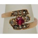 Russian 14ct ruby and diamond crossover ring, outer shank stamped '56' with further indistinct