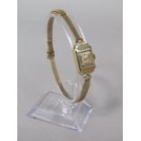 Art Deco 9ct ladies cocktail watch on a 9ct strap and clasp, the champagne dial with gilt Arabic