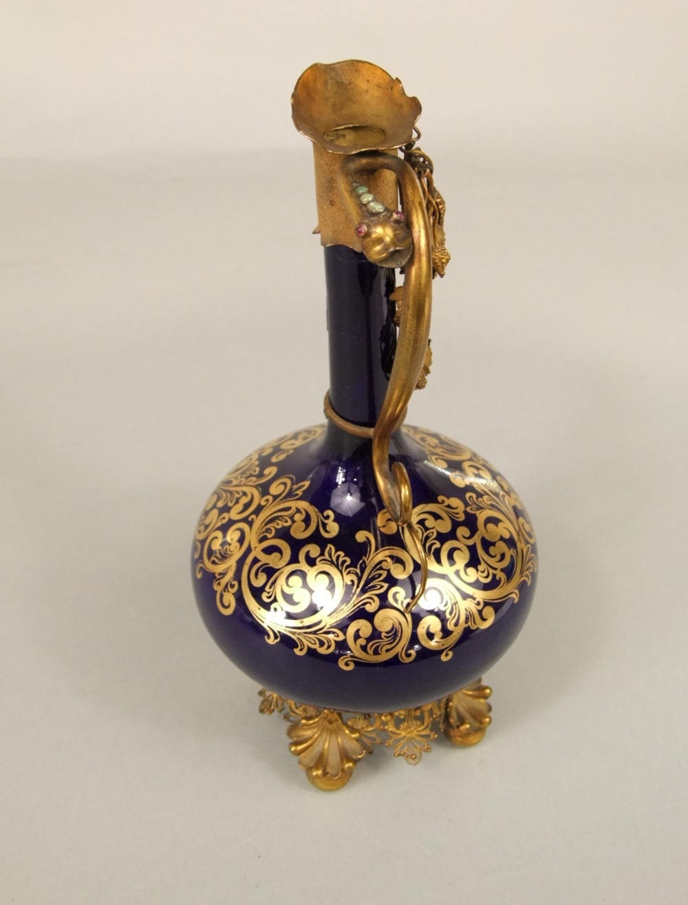 A 19th century blue ground ewer with gilded decoration and ornate gilt metal mounts and base, 22cm - Image 2 of 5