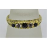 18ct blue spinel and diamond five stone ring with scrolled mount, size N, 3.3g
