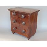 19th century flame mahogany apprentice chest of drawers, fitted with three graduated drawers upon