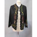 Late 19th/Early 20th century jacket in fine black wool lined with black silk, with embroidered
